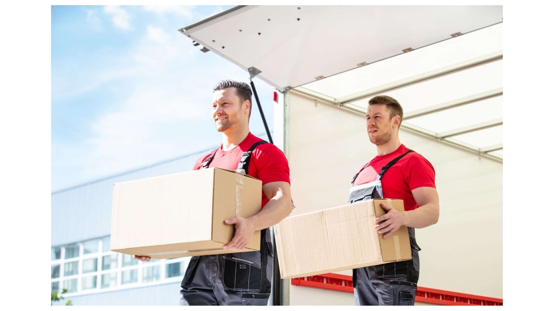 Two Half Price Movers crew members in red shirts unloading boxes from a moving truck in San Antonio